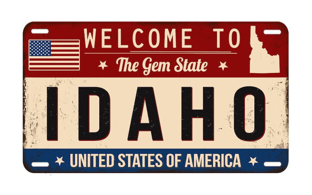 A license plate that says "Welcome to Idaho, the Gem State. United States of America"