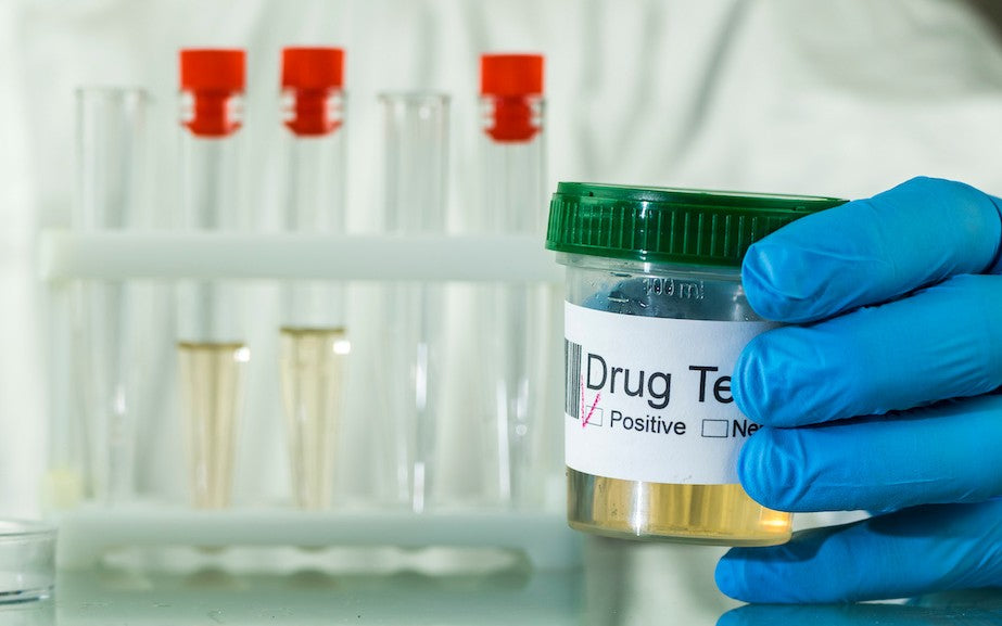 test tubes and a sample jar in a lab