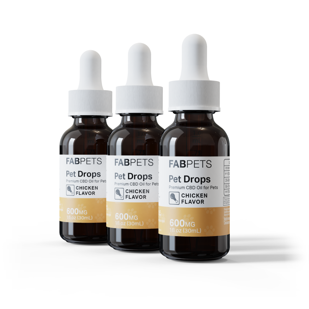 Three-quarter front view of three FABPETS Pet Oil - 3 Pack amber dropper bottles with white caps and yellow chicken-flavor labels on a white background.
