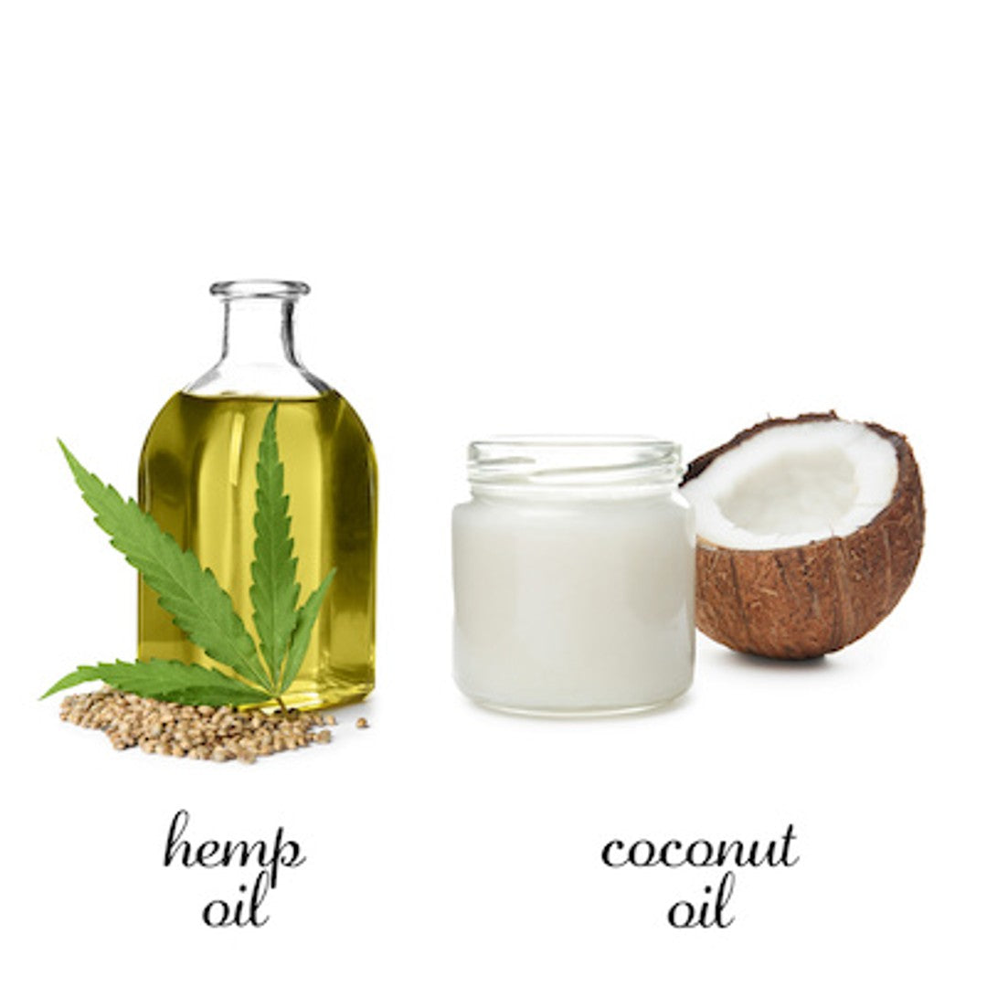 A bottle of hemp oil next to a jar of coconut oil and half of a coconut