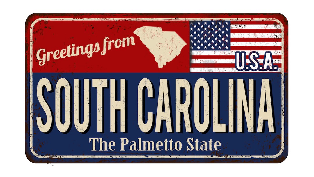 A license plate that says "Greetings from South Carolina, USA. The Palmetto State"