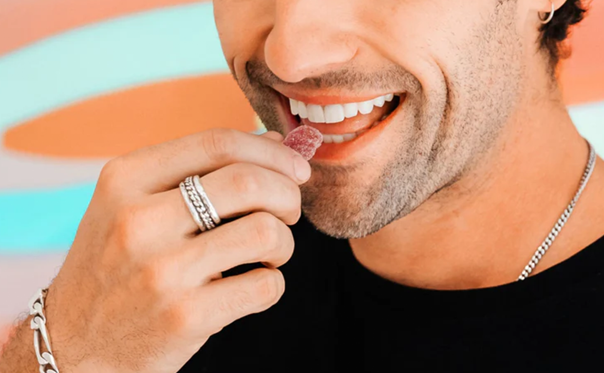 man eating a cbd gummy