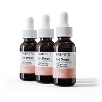 Three dark amber dropper bottles labeled Fab Pets Pet Drops with Bacon flavor and 600mg CBD, arranged in a row.