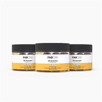 Front-facing trio of clear jars showing colorful sugar-coated gummies, labeled "FABCBD Delta 9 Gummies" with black lids on a white background.