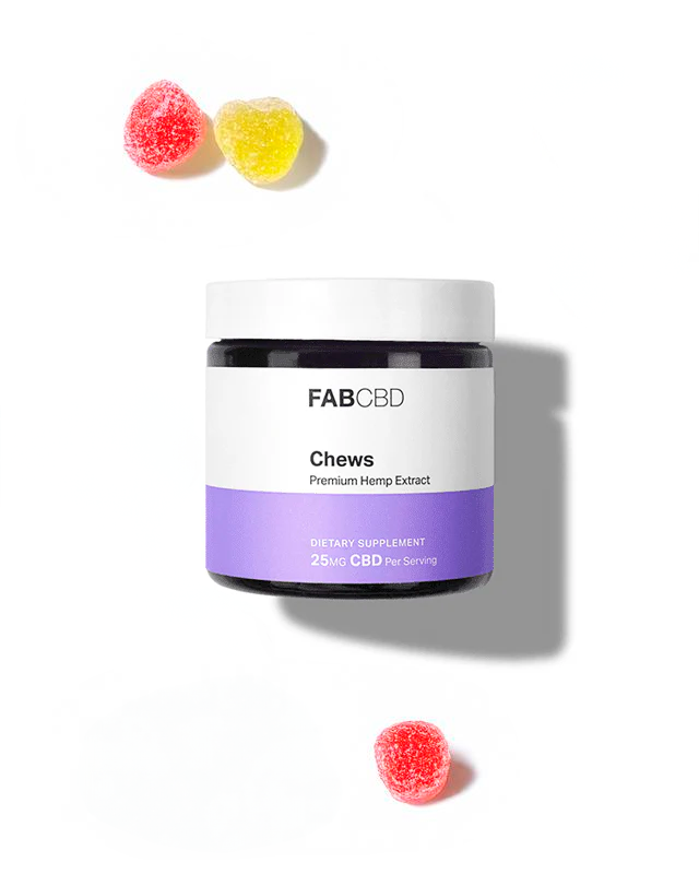 FAB CBD Chews jar with purple label and three red and yellow gummy candies on white background.