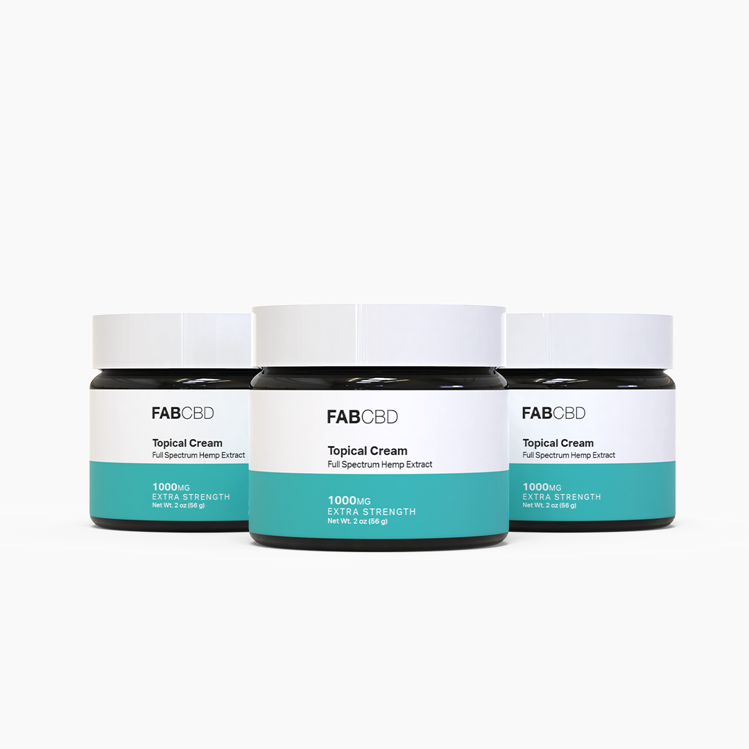 Three white jars of FAB CBD Elite Test topical cream with teal and black labels on white background.