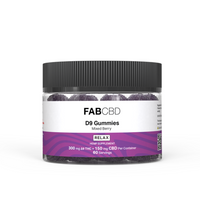 Front-facing shot of a clear jar labeled FABCBD Delta 9 Gummies showing a black ribbed lid, visible purple sugar-coated gummies and a white-and-purple label.