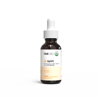 Brown glass dropper bottle of Uplift Broad Spectrum CBD oil with white label and white dropper cap, 1500mg natural variant.
