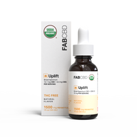 FabCBD Uplift Broad Spectrum CBD oil 1500mg in dark glass dropper bottle with white and orange label next to matching box.