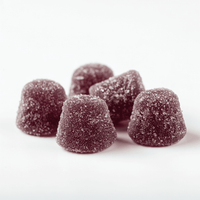 Sugary, dark purple gummy chews with a soft, slightly rounded shape on a white background.
