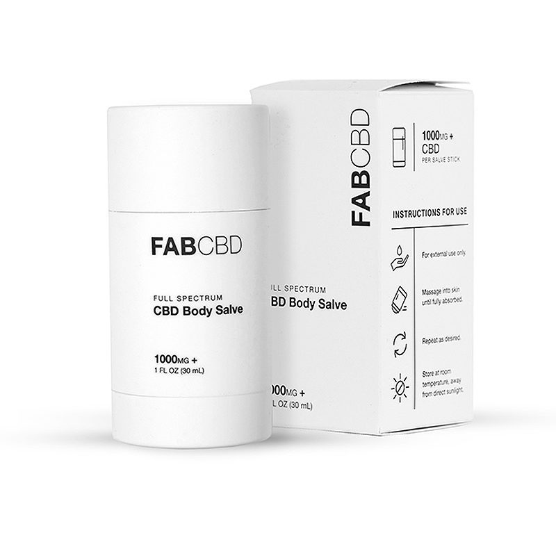 Front three-quarter view of the FABCBD CBD Body Salve stick and matching box on a white background.