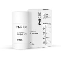 Front three-quarter view of the FABCBD CBD Body Salve stick and matching box on a white background.