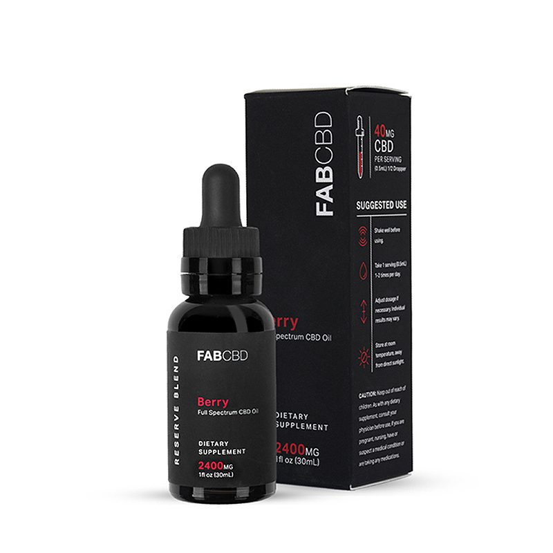 Front three-quarter view of the FABCBD CBD Oil berry 2400mg bottle with dropper standing in front of its black branded box on a white background