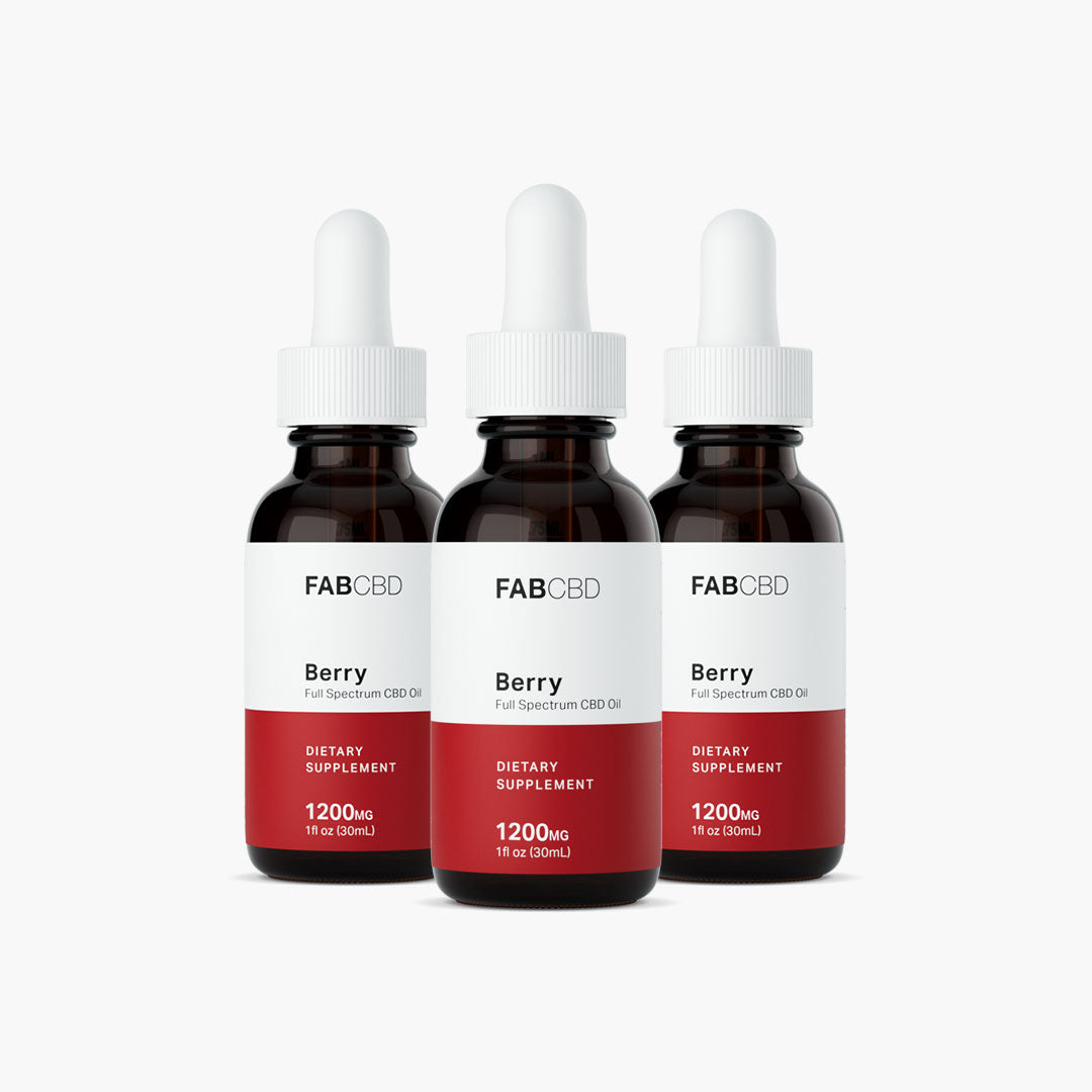 Front-facing trio of FABCBD CBD Oil berry bottles with white droppers and red lower labels against a light gray background.