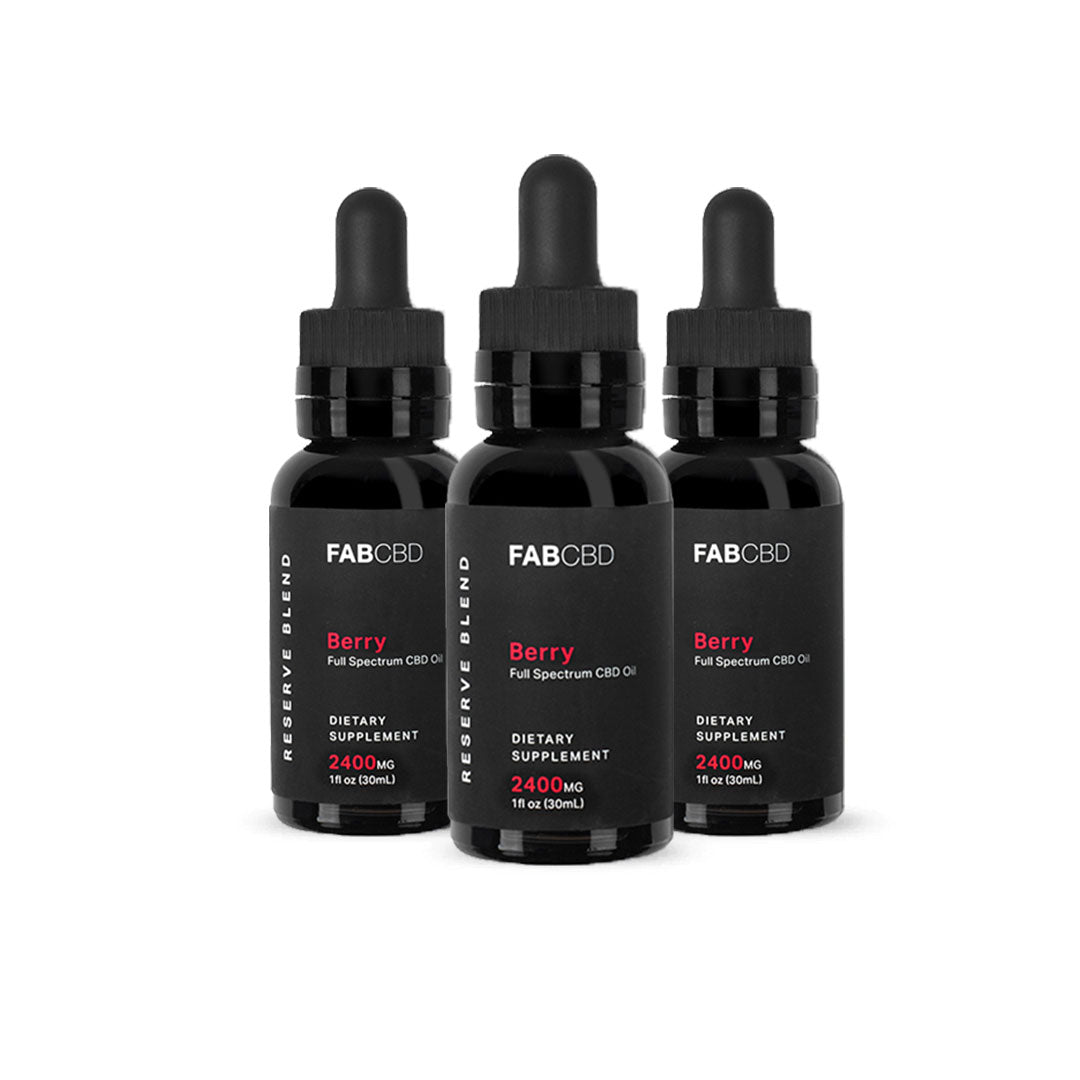 Three front-facing black dropper bottles of FABCBD CBD Oil with "Berry" labels, arranged close together on a white background.