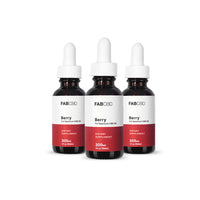 Front-facing trio of FABCBD CBD Oil berry-flavored dropper bottles with white caps and red labels on a white background.
