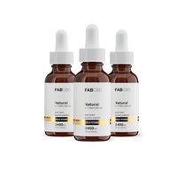 Three amber dropper bottles of FAB CBD Natural 1:1 CBD+CBG Oil dietary supplement standing side by side in a row. Each bottle features a white label with a gold "Gold Standard" banner displaying product specifications, including a potency of 2400MG and a volume of 1 fl oz (30mL), set against a pure white background.