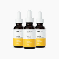 Front-facing trio of FABCBD CBD Oil droppers with white caps and yellow-labeled citrus panels on a white background