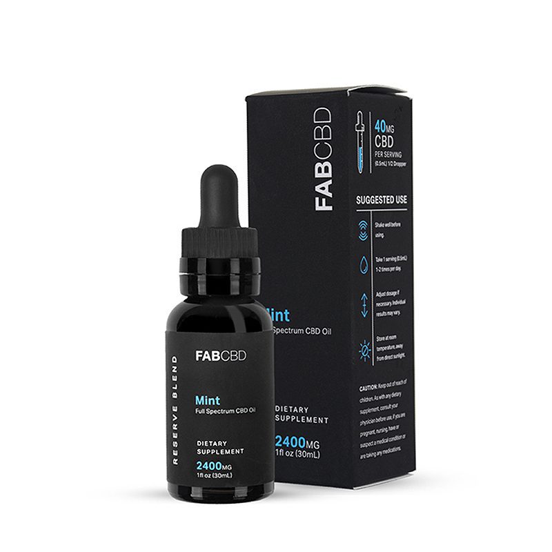 Front three-quarter view of the FAB CBD CBD Oil Mint bottle with dropper standing beside its black branded box on a white background.