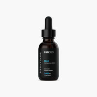 Front-facing studio shot of the FABCBD CBD Oil dropper bottle with black label and mint accent on a white background.