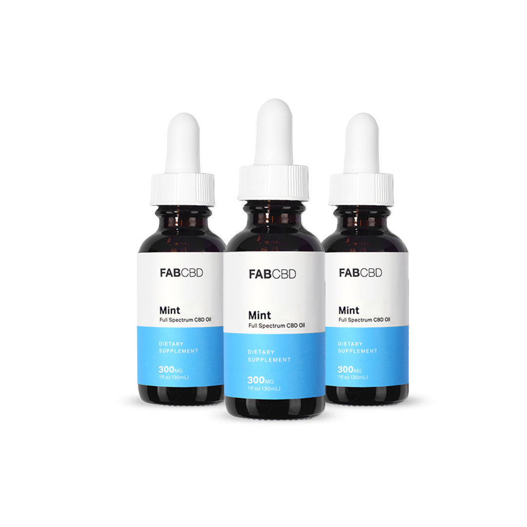 Front-facing trio of FABCBD CBD Oil mint bottles with white droppers and blue lower labels against a white background
