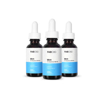 Front-facing trio of FABCBD CBD Oil mint bottles with white droppers and blue lower labels against a white background