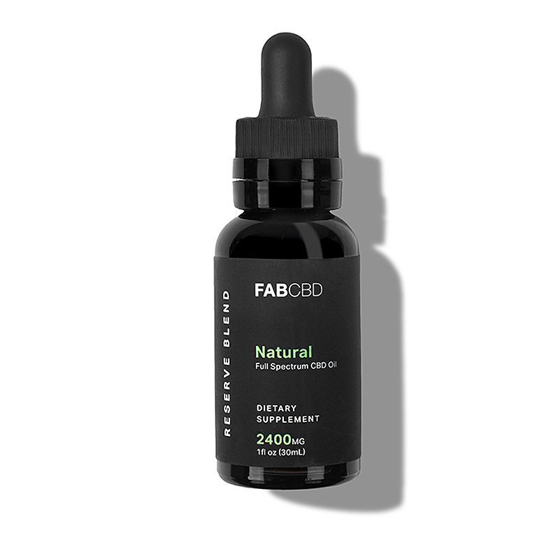 Front-facing bottle shot of FAB CBD CBD Oil with a black label and dropper casting a soft shadow on a white background.