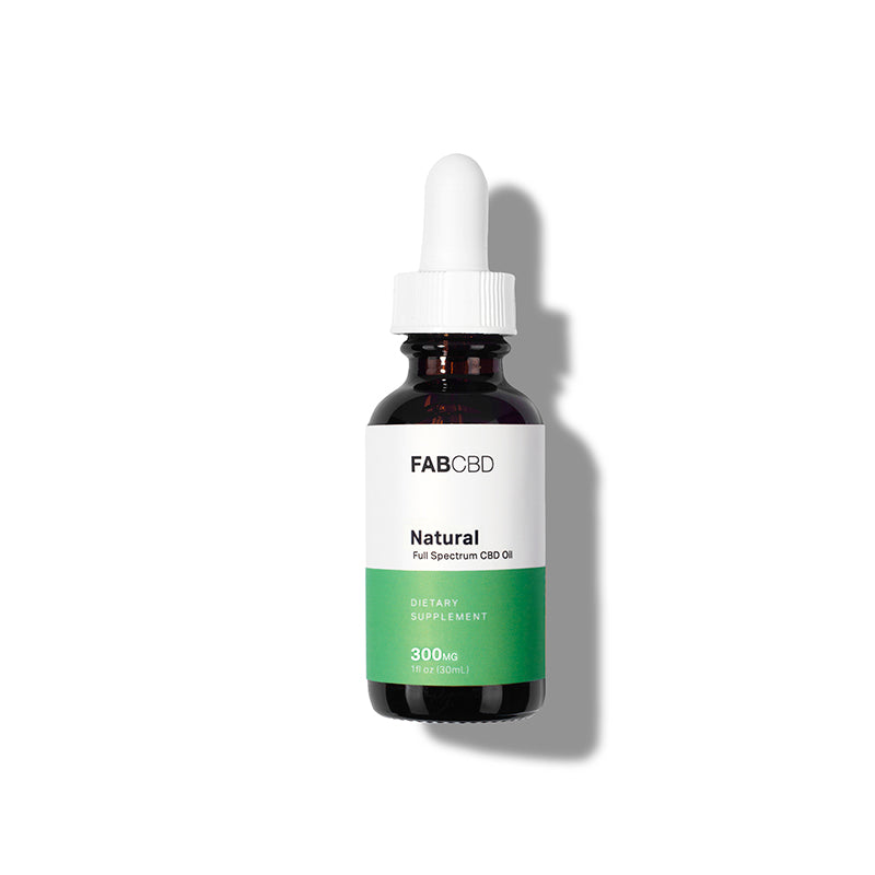 Centered studio shot of the FABCBD CBD Oil bottle with white dropper casting a soft shadow on a white background