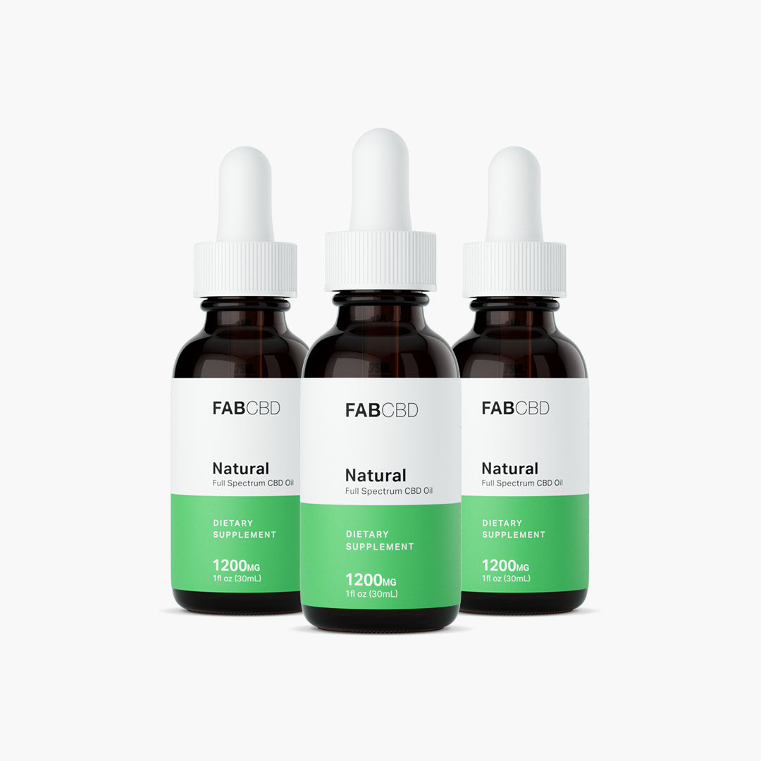 Front-facing trio of FABCBD CBD Oil 1200mg amber dropper bottles with white caps and green labels on a white background