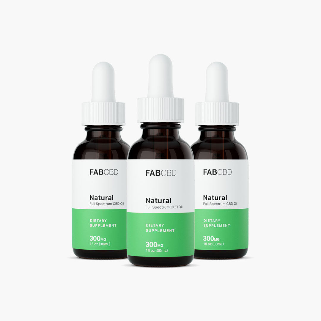 Front-facing trio of FAB CBD CBD Oil 300mg amber dropper bottles with white caps and green-and-white labels on a bright white background.