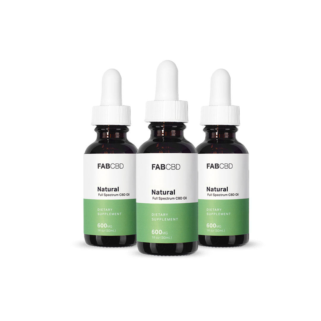 Front view of three FABCBD CBD Oil brown glass dropper bottles with white caps and green-and-white labels arranged side by side on a white background.