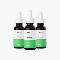 Front view of three FAB CBD CBD Oil dropper bottles with white caps and green labels evenly spaced against a white background.