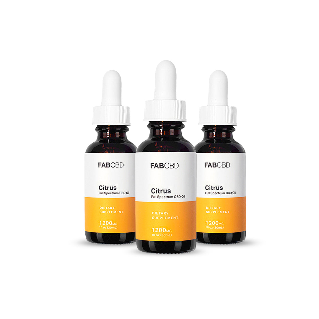 Front view of three FABCBD CBD Oil amber dropper bottles with white labels and orange accents arranged side-by-side on a white background