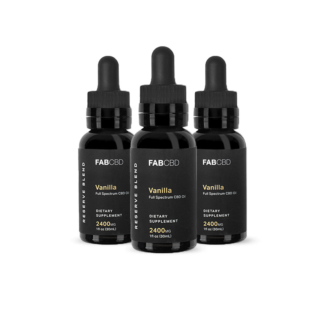 Front-facing trio of FABCBD CBD Oil 2400mg vanilla bottles with black dropper caps arranged against a white background.