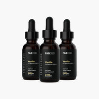 Center-front view of three FABCBD CBD Oil vanilla bottles with black droppers and black labels on a white background.