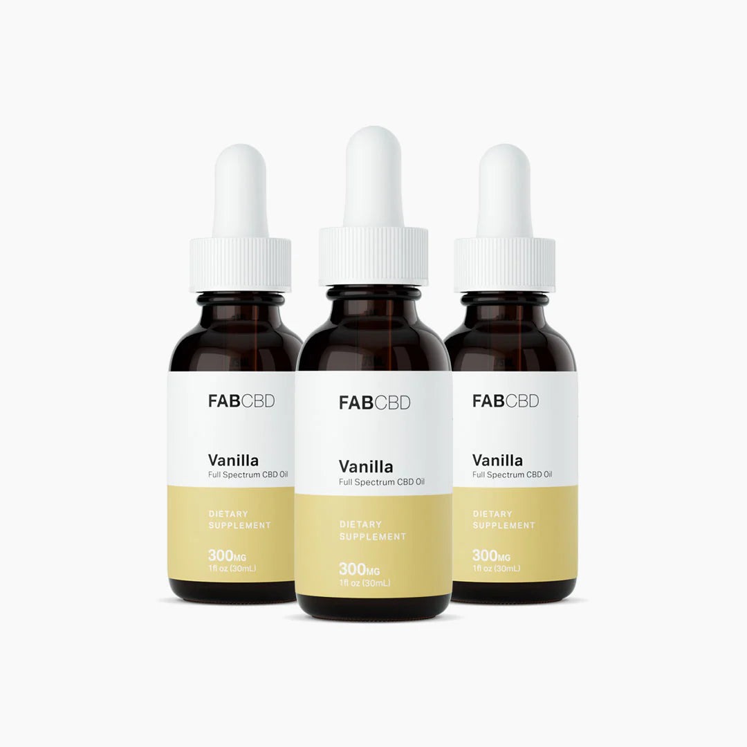 Front-facing trio of FABCBD CBD Oil vanilla bottles with white droppers and pale yellow labels against a white background