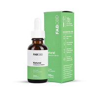 Front-facing bottle and box of FABCBD CBD Oil Natural full-spectrum tincture, brown glass bottle with green-white label beside its green box.