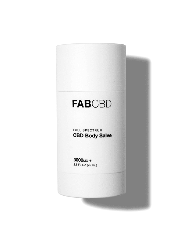 Front-lit, slightly elevated view of the FABCBD CBD Body Salve stick on a white background casting a soft shadow to the right.