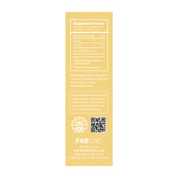 Vertical close-up of the yellow product label for CBD Oil showing Supplement Facts, a QR code, and the FABCBD branding at the bottom.